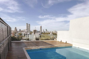 Amplio departamento con piscina y vista a la ciudad